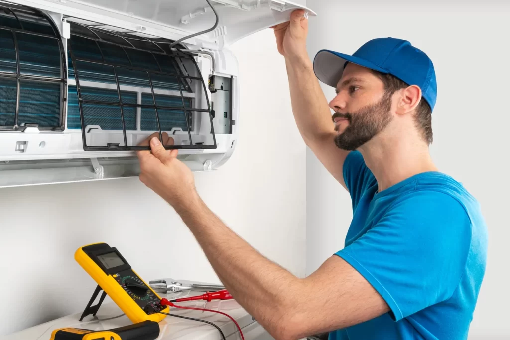 A technician doing air conditioning installation in Calgary, AB
