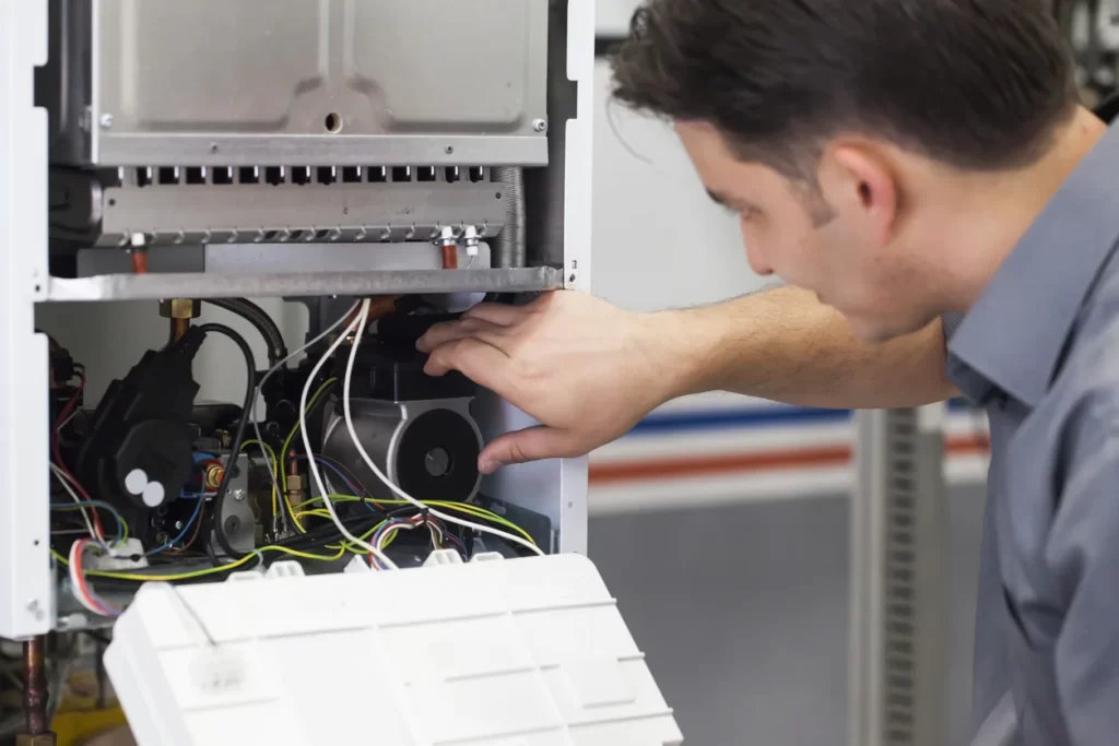 Technician doing furnace repair Calgary, AB