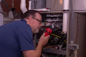 ProStar Plumbing crew doing furnace maintenance Calgary, AB