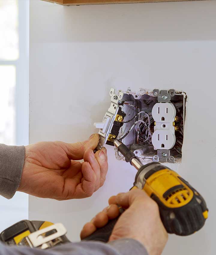 A person doing electrical services in Calgary, AB