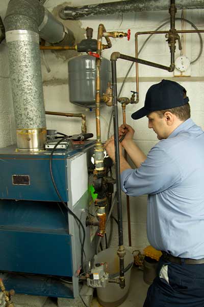 A plumber doing furnace installation calgary, AB