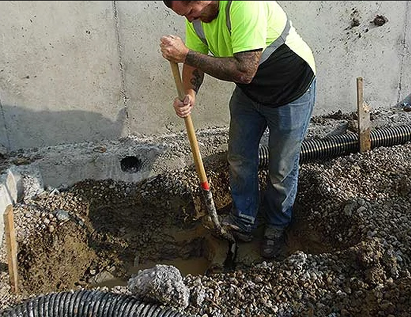 Worker digging sewer line ProStar Plumbing in Calgary, AB