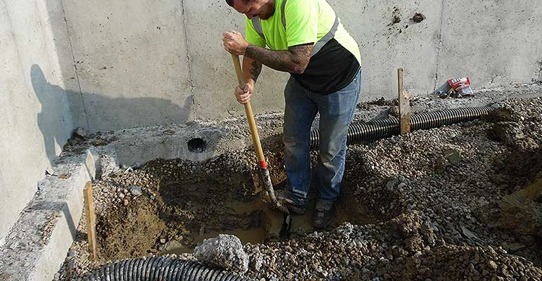 Worker digging sewer line ProStar Plumbing in Calgary, AB