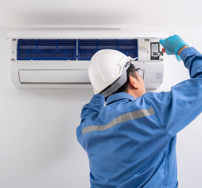 Man installing Air Condition in Calgary, AB