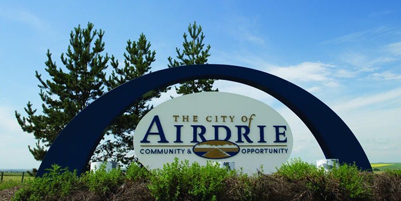 Welcome sign for "The City of Airdrie - Community & Opportunity".